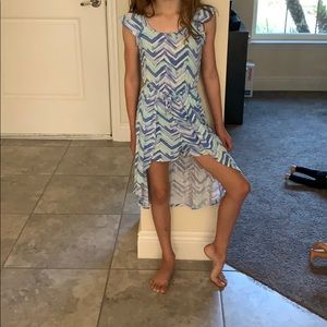 Justice Romper half skirt in the back with shorts.